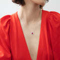 Model wearing Flower Halo CZ Necklace and Earrings in Sterling Silver, Ruby Color