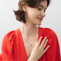 Model wearing Flower Halo CZ Necklace and Earrings in Sterling Silver, Ruby Color