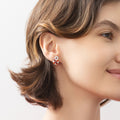 Model wearing Key Lock CZ Stud Earrings in Sterling Silver, Clear Color