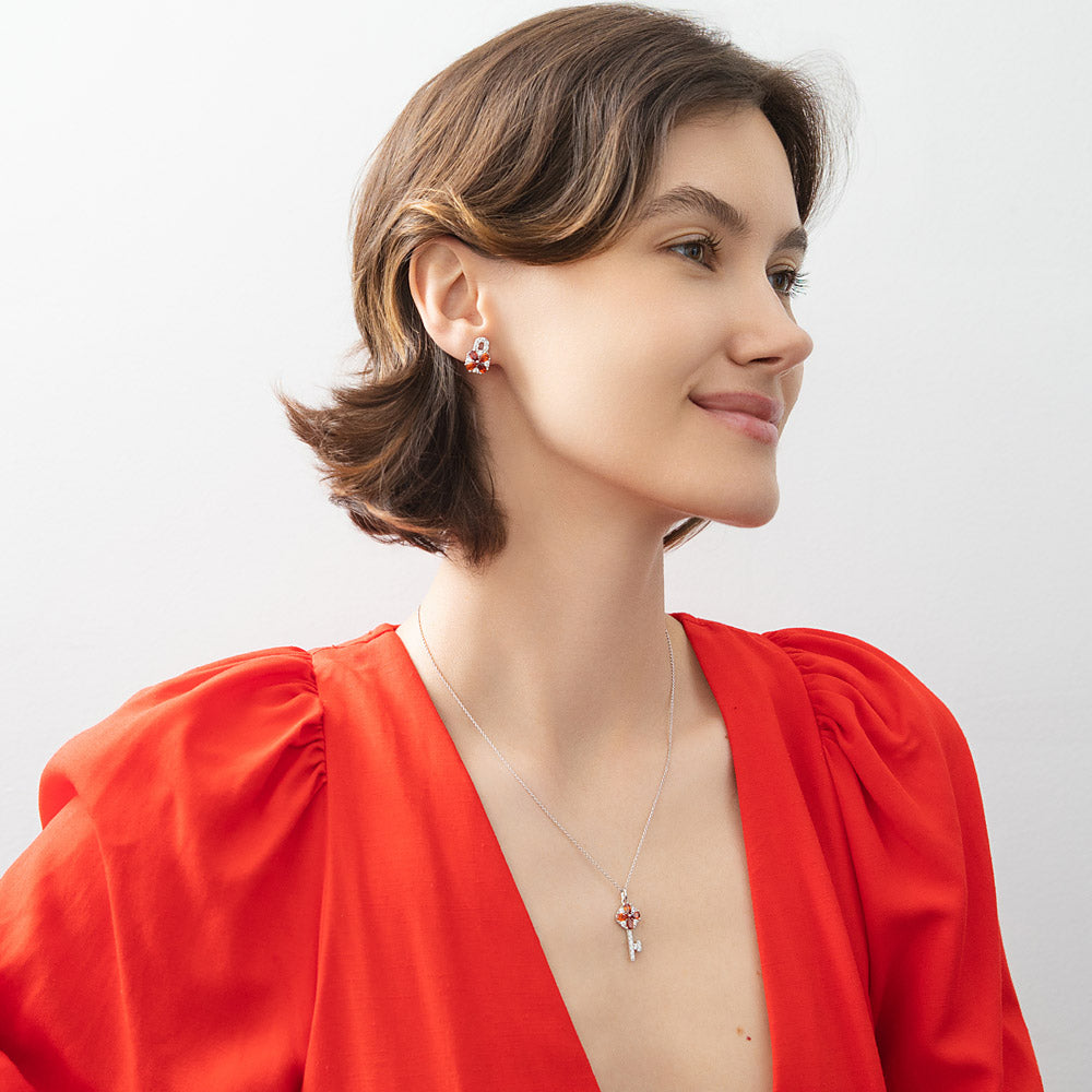 Model wearing Key Lock CZ Stud Earrings in Sterling Silver, Red Color