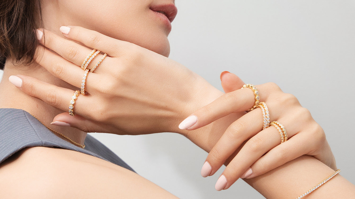 model wearing gold flashed eternity bands