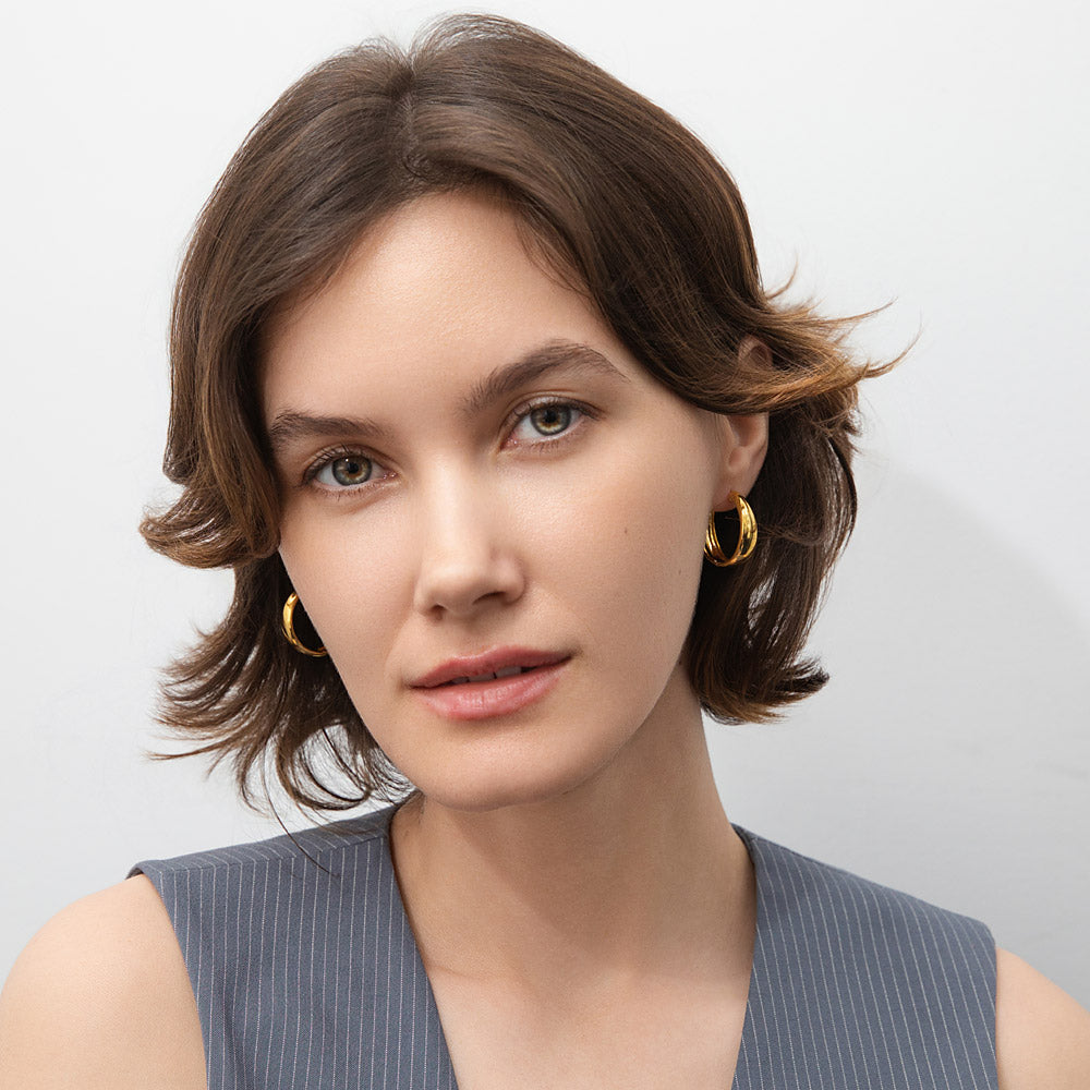 Model wearing Dome Hoop Earrings in Gold Flashed Sterling Silver, 2 Pairs, 3 of 19