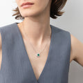 Model wearing Flower Halo CZ Necklace and Earrings in Sterling Silver, Emerald Color