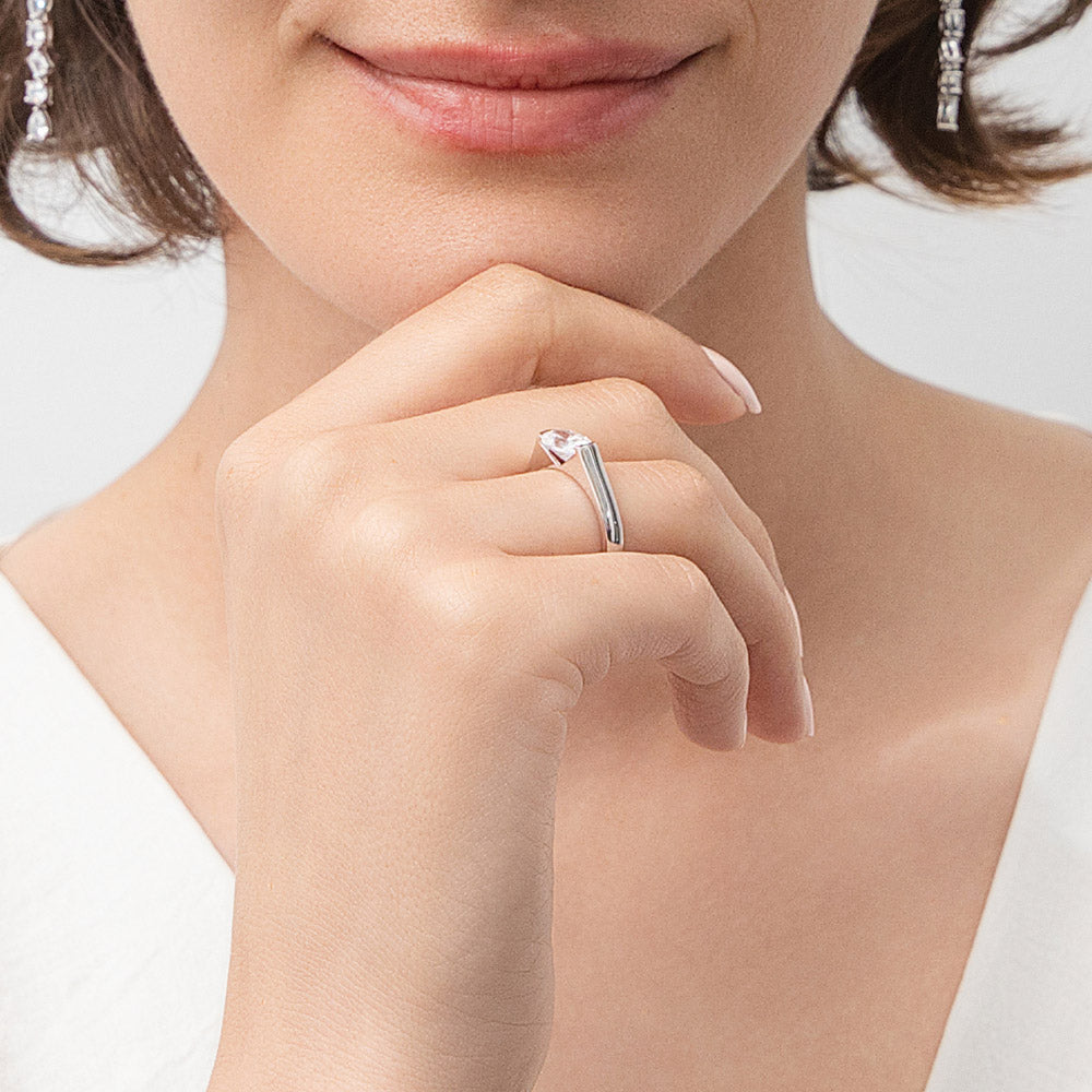Model wearing Solitaire 1.2ct Half Bezel Set Oval CZ Ring in Sterling Silver, 3 of 9