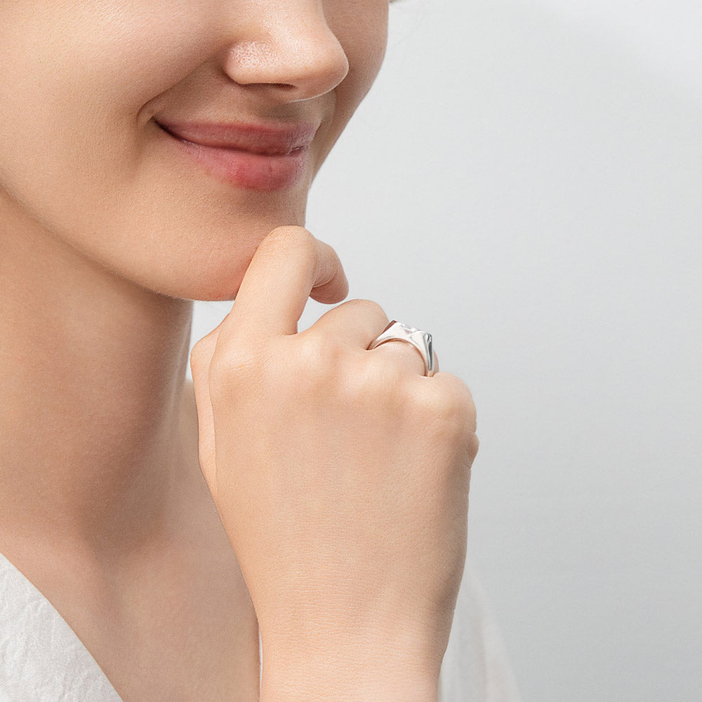 Model wearing East-West Solitaire 1ct Bezel CZ Ring in Sterling Silver, 7 of 11