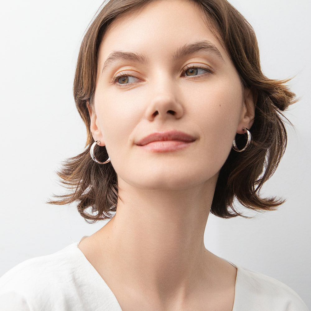 Model wearing Dome Hoop Earrings in Sterling Silver, 2 Pairs, 3 of 16