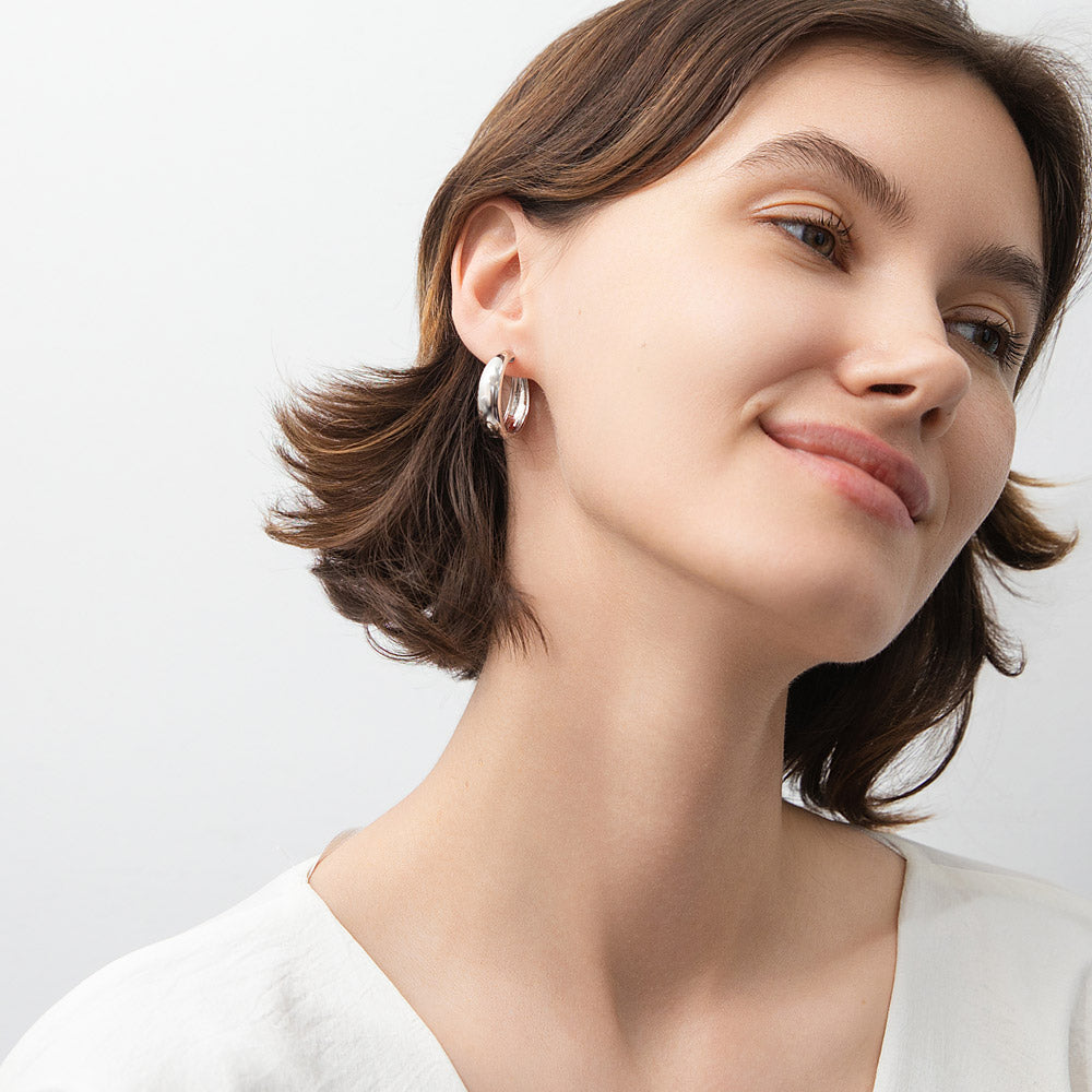 Model wearing Dome Hoop Earrings in Sterling Silver, 2 Pairs, 2 of 16