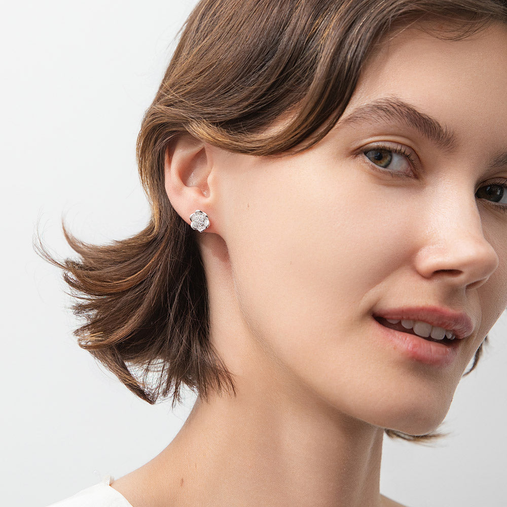 Model wearing Flower CZ Stud Earrings in Sterling Silver, 2 of 6