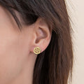 Model wearing Snowflake Coin Stud Earrings in Sterling Silver, Yellow Gold Flashed