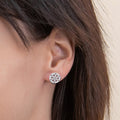 Model wearing Snowflake Coin Stud Earrings in Sterling Silver, Yellow Gold Flashed