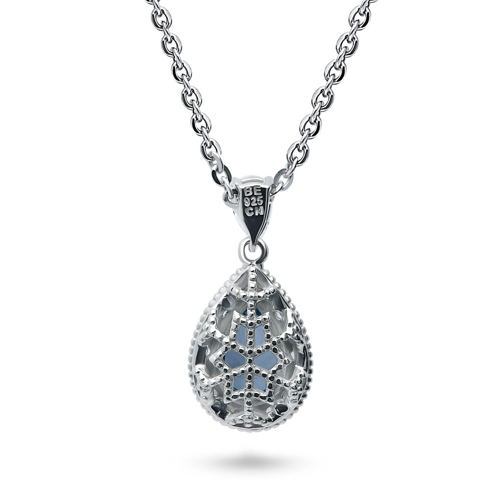 Angle view of Halo Pear CZ Necklace and Earrings in Sterling Silver, Blue