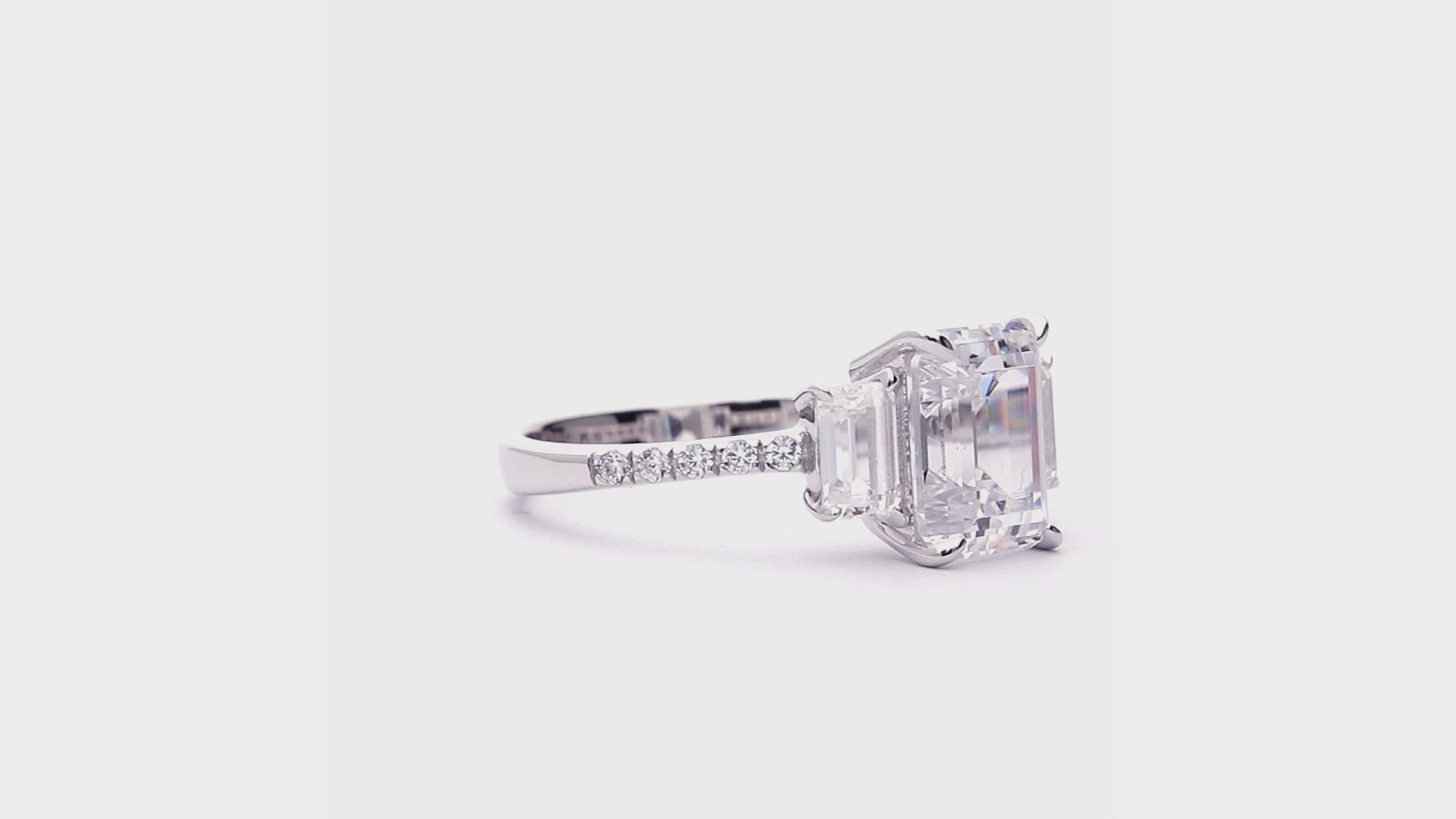 Video Contains 3-Stone 2.1ct Emerald Cut CZ Ring in Sterling Silver. Style Number R1872-01