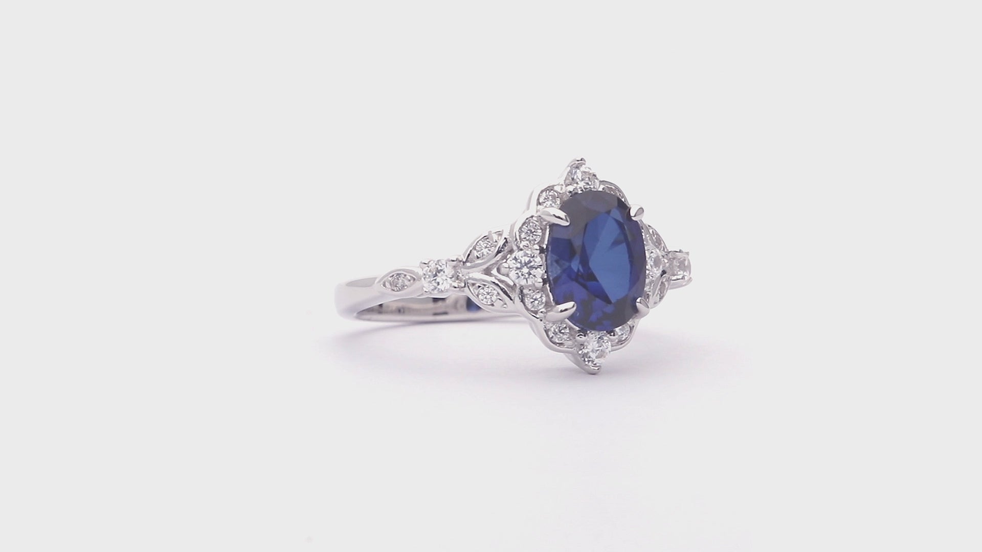 Video Contains Halo Simulated Blue Sapphire Oval CZ Ring Set in Sterling Silver. Style Number VR628-03