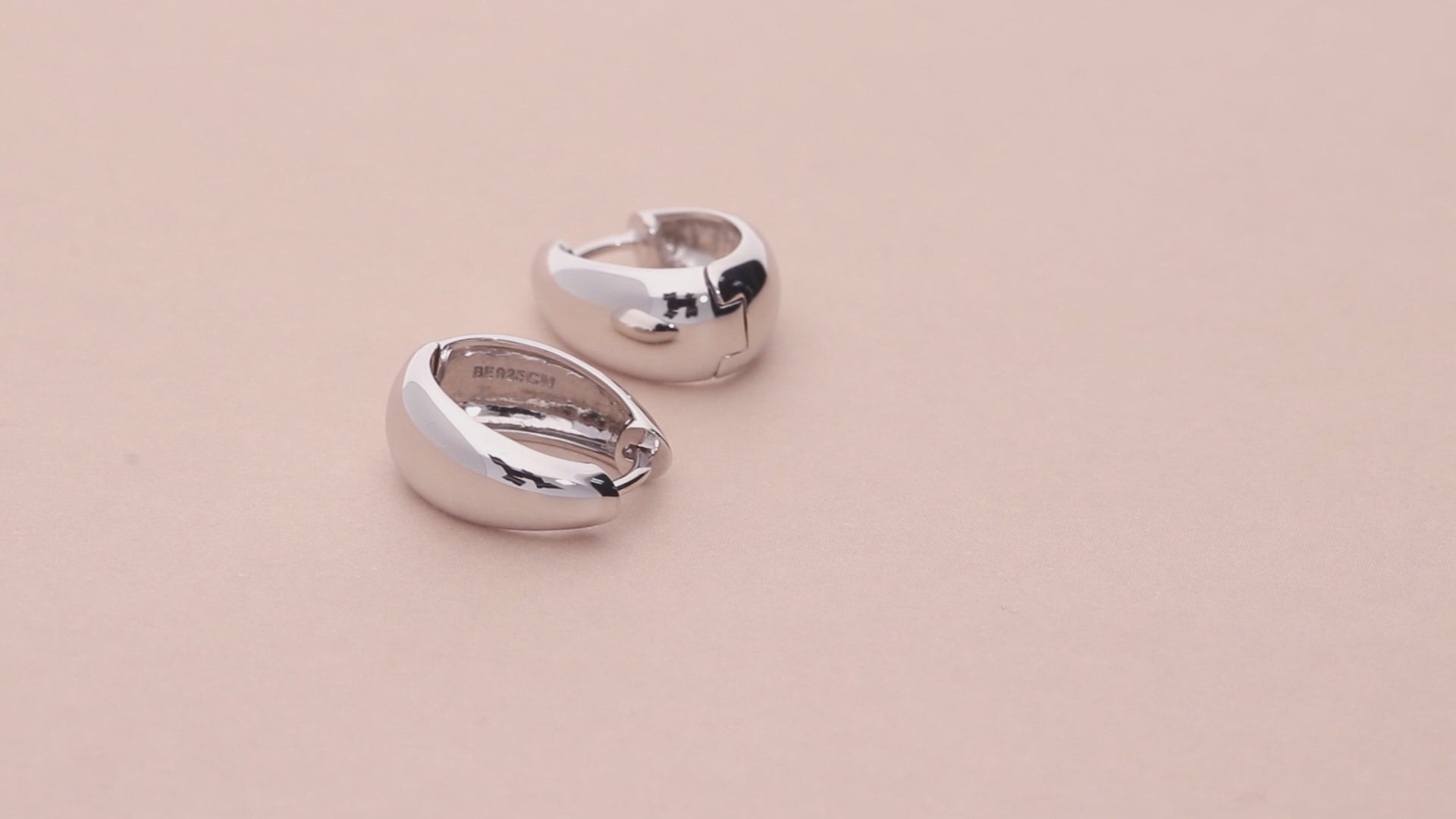 Video Contains Oval Dome Medium Huggie Earrings in Sterling Silver 0.63". Style Number E1705