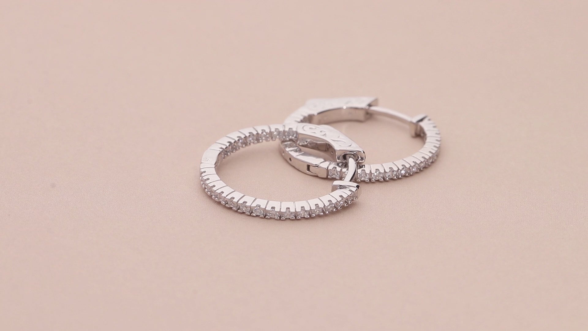 Video Contains CZ Medium Inside-Out Hoop Earrings in Sterling Silver 0.75". Style Number E947-VP