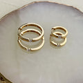 Flatlay view of Solitaire CZ Small Hoop Earrings in Gold Flashed Sterling Silver