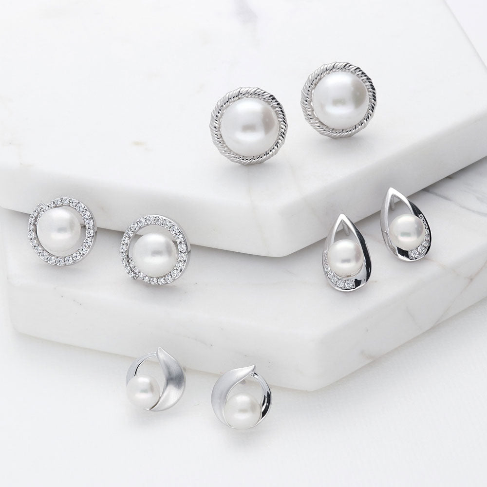 Flatlay view of Solitaire Button Cultured Pearl Stud Earrings in Sterling Silver, 6 of 7