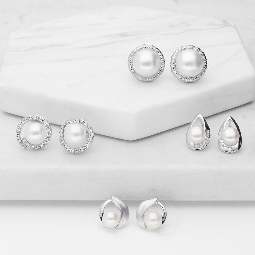 Flatlay view of Solitaire Button Cultured Pearl Stud Earrings in Sterling Silver, 5 of 7