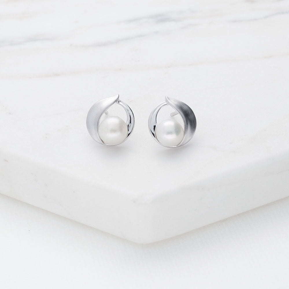 Flatlay view of Solitaire Button Cultured Pearl Stud Earrings in Sterling Silver, 3 of 7