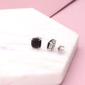 Flatlay view of Square CZ Necklace and Earrings in Sterling Silver, Black Color