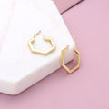 Flatlay view of Hexagon Medium Hoop Earrings in Sterling Silver 0.79 inch, Yellow Gold Flashed