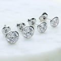 Flatlay view of Solitaire Bezel CZ Stud Earrings in Sterling Silver, 4mm