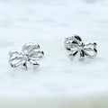 Flatlay view of Bow Tie Ribbon Stud Earrings in Sterling Silver, Style 1