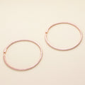 Flatlay view of CZ Large Inside-Out Hoop Earrings in Sterling Silver 2.5 inch, Rose Gold Flashed