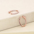 Flatlay view of Oval CZ Medium Inside-Out Hoop Earrings in Sterling Silver 0.84 inch, Rose Gold Flashed