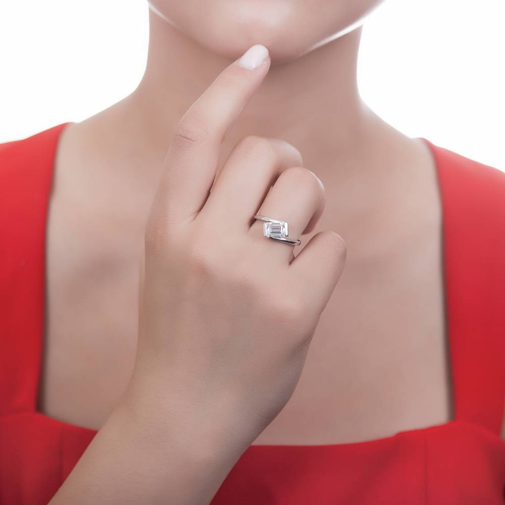 Model wearing Solitaire Bypass 1.7ct Emerald Cut CZ Ring in Sterling Silver, 2 of 7