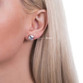 Model wearing Solitaire Asscher CZ Stud Earrings in Sterling Silver, 8mm