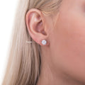 Model wearing Solitaire CZ Stud Earrings in Sterling Silver, 7mm