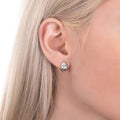 Model wearing Dome Mini Huggie Earrings in Sterling Silver 0.45 inch, Rhodium Plated