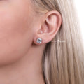 Model wearing Solitaire Asscher CZ Stud Earrings in Sterling Silver, 7mm