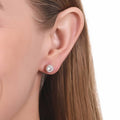 Model wearing Solitaire 1.6ct Crown Set CZ Stud Earrings in Sterling Silver, Rose Gold Flashed