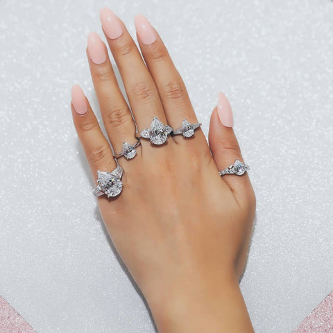 Image Contain: Model Wearing 3-Stone Ring, Solitaire Ring, Solitaire with Side Stones Ring