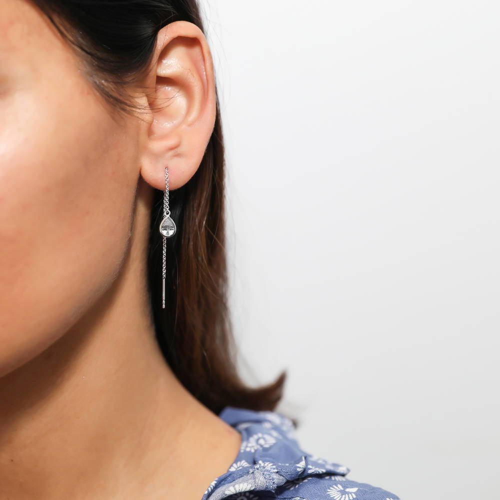 Model wearing Solitaire Pear CZ Threader Earrings in Sterling Silver 1.6ct, 2 of 4