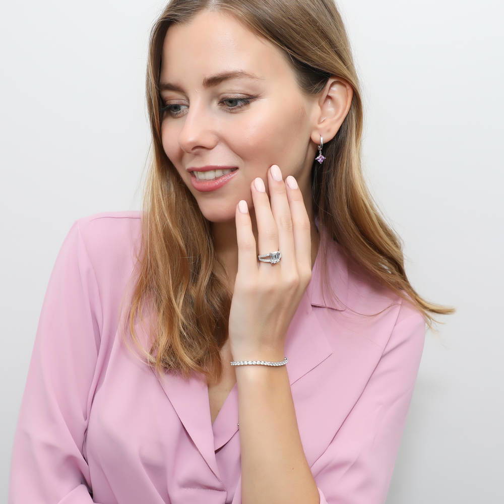 Model wearing Solitaire Purple Princess CZ Earrings in Sterling Silver 2.4ct, 4 of 5