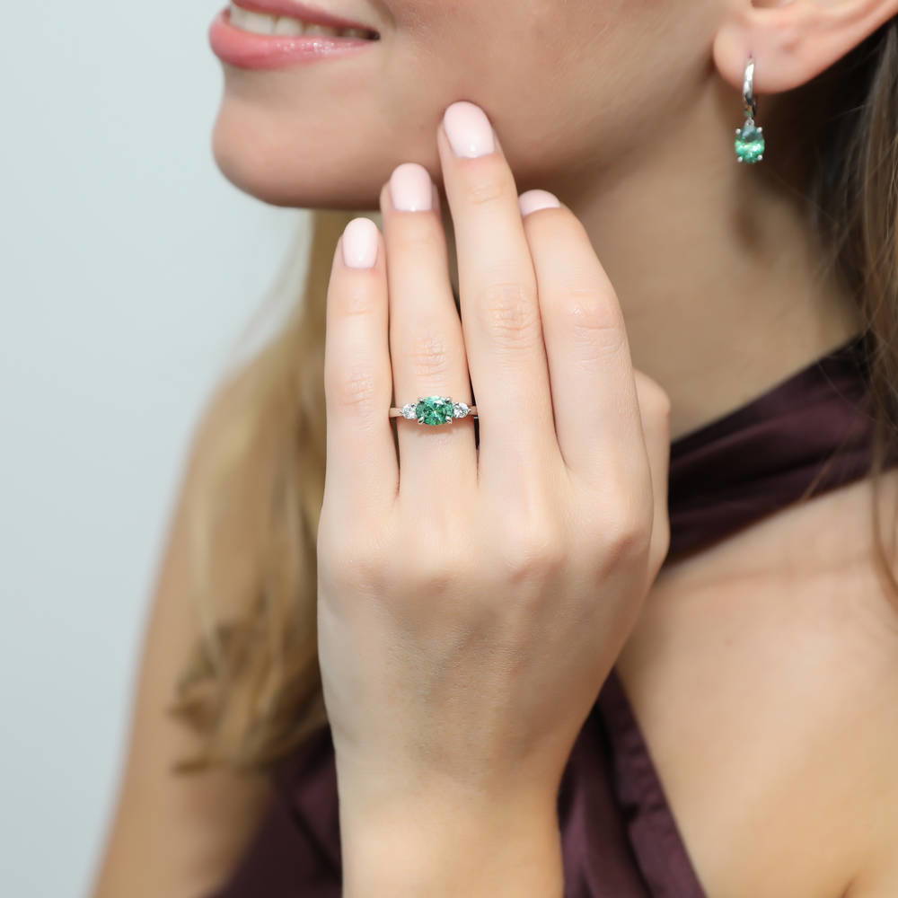 Model wearing 3-Stone East-West Green Oval CZ Ring in Sterling Silver 1.2ct, 2 of 8