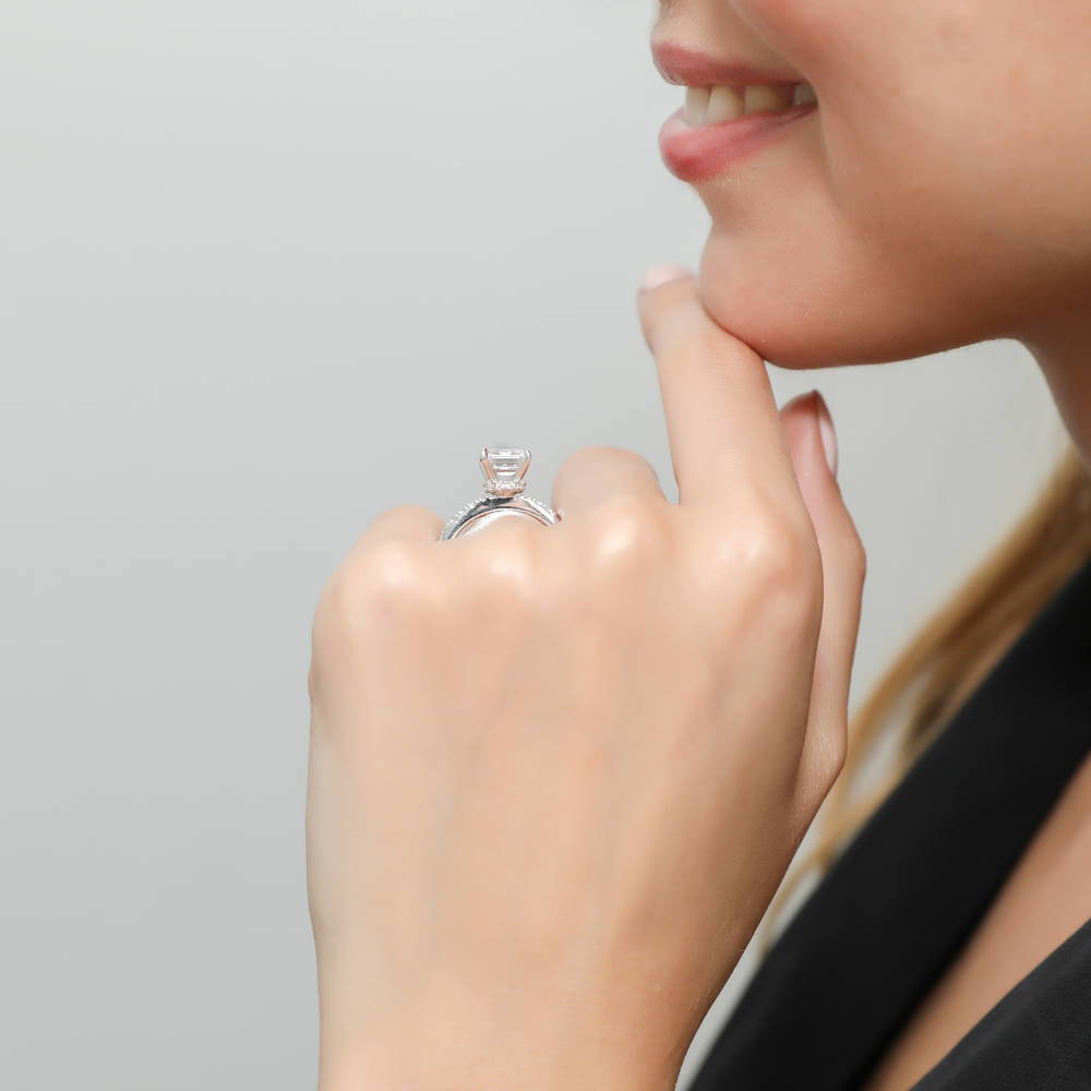 Model wearing Solitaire Hidden Halo Emerald Cut CZ Ring in Sterling Silver, 3 of 8