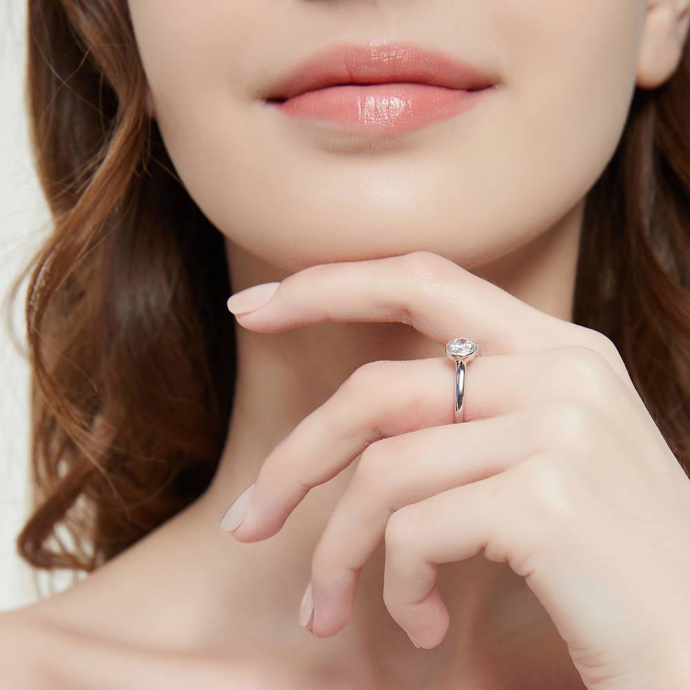 Model wearing Solitaire 0.8ct Bezel CZ Ring in Sterling Silver, 6 of 8