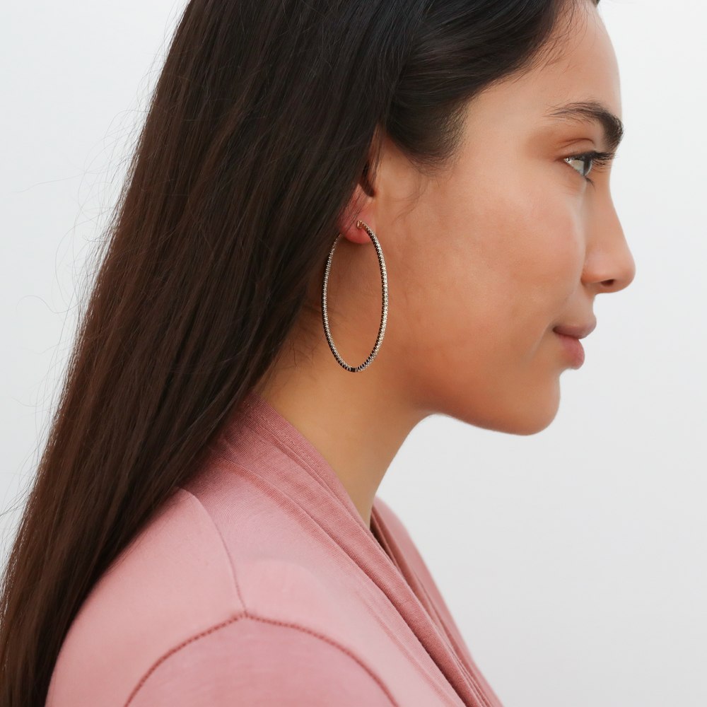 Model wearing Oval CZ Inside-Out Hoop Earrings in Gold Flashed Sterling Silver, 6 of 7