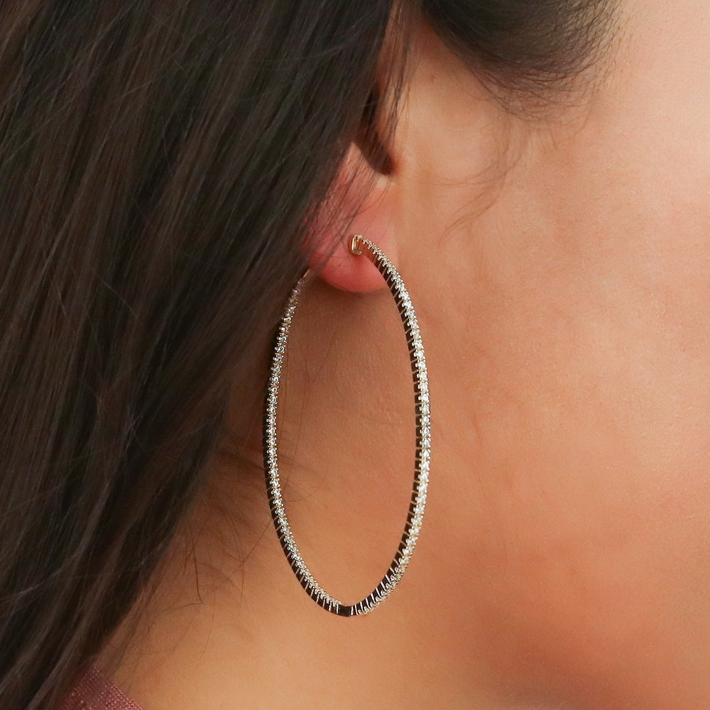 Model wearing Oval CZ Inside-Out Hoop Earrings in Gold Flashed Sterling Silver, 5 of 7