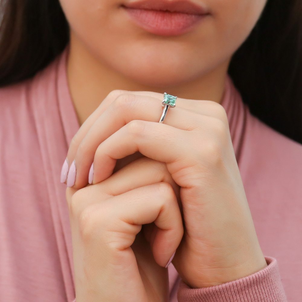 Model wearing Solitaire 1.2ct Green Princess CZ Ring Set in Sterling Silver, 9 of 13