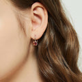 Model wearing Kaleidoscope Solitaire CZ Leverback Earrings in Sterling Silver, Red Orange Color