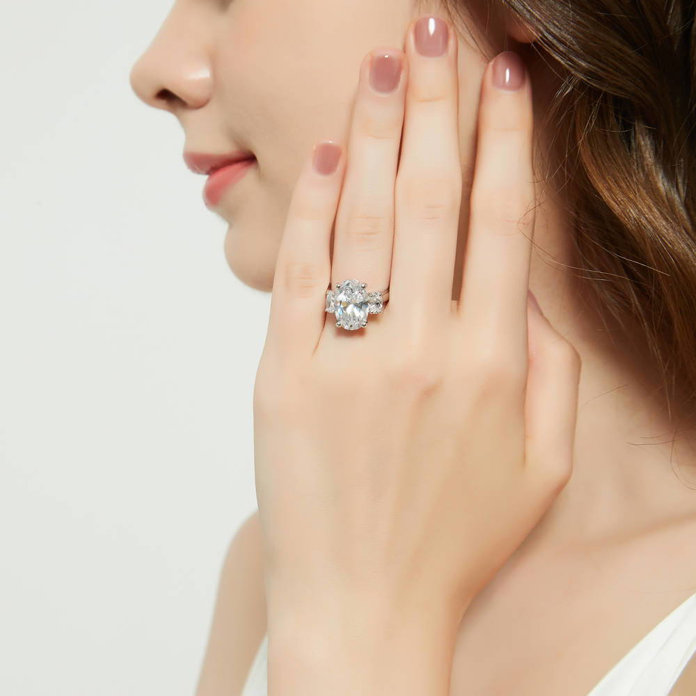 Model wearing 3-Stone Oval CZ Statement Ring in Sterling Silver, 3 of 14