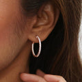 Model wearing CZ Medium Inside-Out Hoop Earrings in Sterling Silver 1 inch, Rose Gold Flashed