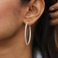 Model wearing CZ Large Inside-Out Hoop Earrings in Sterling Silver 1.8 inch, Rose Gold Flashed