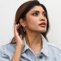 Model wearing CZ Medium Inside-Out Hoop Earrings in Sterling Silver 1.4 inch, Rose Gold Flashed