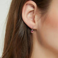 Model wearing Kaleidoscope Solitaire CZ Leverback Earrings in Sterling Silver, Red Orange Color